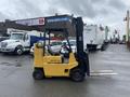 A yellow 2010 Hyster S80XLBCS forklift with a black mast and forks positioned upright