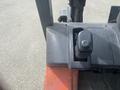 Close-up of the control panel of a 2010 Toyota 7FGGU25 forklift featuring gear shifters and various operational controls