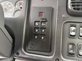 Interior control panel of a 2005 Freightliner M2 106 featuring buttons for gear selection including R N D and a mode button along with additional controls