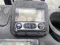 A close-up view of the dashboard of a 2011 Toyota 028FG15 forklift featuring a digital display with odometer and trip information buttons