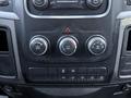 Control panel of a 2018 RAM 5500 featuring climate control knobs and various switches for hazard lights and auxiliary functions
