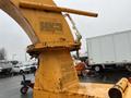 A yellow 1993 Bandit 200+ wood chipper with a large feed chute and safety warning labels near the base