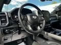 Interior view of a 2019 RAM 1500 showcasing the steering wheel dashboard and central touchscreen display