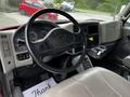 Interior view of a 2011 International 4400 showing the steering wheel dashboard and controls with a focus on the driver's seat and cabin layout