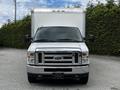 Front view of a 2018 Ford Econoline truck with a large cargo box attached to the rear