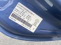 A blue 2007 Chrysler PT Cruiser with a visible identification label and vehicle specifications attached