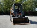 2017 Gehl R105 compact loader with a front bucket positioned at the ground level facing forward
