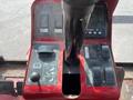 Close-up of the control panel of a 2014 Toro Groundmaster 5910 featuring various levers buttons and a digital display