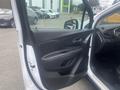 Interior view of a 2018 Buick Encore showing the driver's side door with controls and a leatherette finish