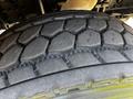 Close-up of a tire tread from a 2012 Freightliner M2 112 showing distinct patterns and grooves designed for traction and stability