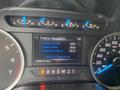 A digital display showing engine information for a 2017 Ford F-150 including oil life percentage engine hours and odometer reading