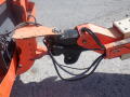 A close-up view of the mechanical joint and hydraulic lines of a 2008 JLG Boom Lift showing the connection point and operational components