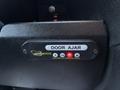 A black interlock system panel with the text 'DOOR AJAR' and indicator lights for power and lock status mounted inside a RAM Promaster vehicle