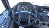 View of the steering wheel and dashboard of a 2014 Freightliner Thomas Bus Diesel showing gauges controls and buttons