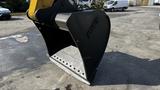 A 2018 Caterpillar 326F L Excavator bucket with a large opening and teeth designed for digging and lifting materials