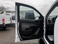 The interior door panel of a 2019 Chevrolet Colorado with a black handle and armrest