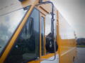 A 2008 Freightliner MT45 Chassis with a large yellow delivery box and a side mirror attached to the driver's side