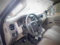 Interior of a 2008 Ford F-550 featuring a dashboard with gauges steering wheel and beige leather seats