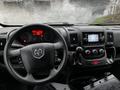 Interior view of a 2018 RAM Promaster showing the steering wheel dashboard and center console with control buttons and a digital display