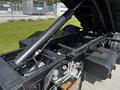 2009 Ford LCF 550 displaying its chassis with hydraulic components and suspension systems visible