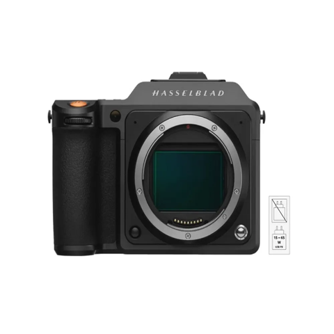 A Hasselblad X2d 100c medium format mirrorless camera featuring a black body and a large sensor opening without a lens attached
