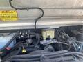 Close-up of the engine compartment of a 2007 Morgan Olson Workhorse W42 showing various components including the coolant reservoir and wiring harnesses