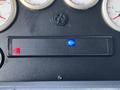 Control panel of a 2006 Emergency One Fire Truck featuring various gauges and a display with indicators for engine status