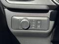Control panel of a 2020 Ford Escape displaying light controls and settings including headlight adjustments