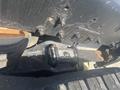 Close-up view of a 2008 Peterbilt 340 truck's chassis showing bolts and a mounted component with visible wear and rust