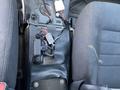 A 2019 Dodge Charger interior featuring a center console with exposed wiring and electrical connectors on the floor between the front seats