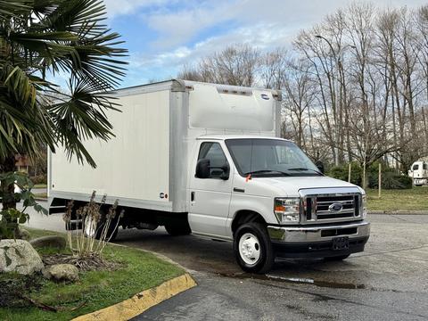 A 2022 Ford E-450 white box truck with a large cargo area and a front grille featuring the Ford emblem