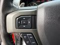 Steering wheel controls of a 2019 Ford F-150 including buttons for navigation and settings