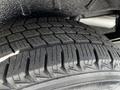 Close-up view of a tire tread from a 2015 Ford Transit showcasing deep grooves and patterns designed for traction on various surfaces