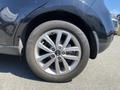 A close-up of a black 2017 Kia Soul's rear wheel showcasing a five-spoke alloy rim and Kumho tire