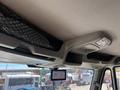 Interior view of a 2018 International DuraStar showing overhead storage net and dashboard display screen