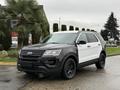 A 2019 Ford Explorer with a black front and white rear, featuring black wheels and a distinctive two-tone color scheme