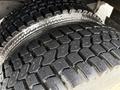 Close-up of a rugged tire with deep tread patterns designed for traction and durability on a 2012 Ford Econoline