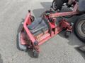 A red 2012 Toro Groundsmaster 5910 mowing attachment with wheels and a black engine compartment is positioned on the ground
