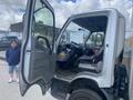 A 2012 Hino XJC720 truck with an open driver's side door revealing the interior dashboard and seating area
