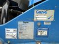 A blue 2020 Genie GTH-5519 telehandler showing various identification and registration stickers on its side
