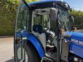 A 2018 New Holland Boomer 45 tractor with a blue exterior and a transparent cab showcasing the interior seating and controls