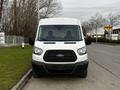 Front view of a white 2017 Ford Transit van with two seats visible inside and a large windshield