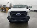 A white 2017 Ford F-250 Super Duty truck facing forward with a black grill and the Ford logo prominently displayed in the center