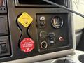 Interior dashboard controls of a 2016 International 7400 featuring yellow and red air supply knobs gauge and switches