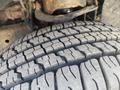 Close-up of a tire tread from a 2013 Ford Expedition showing deep grooves and patterns for traction
