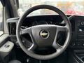 Interior view of a 2021 Chevrolet Express showing the steering wheel dashboard and controls in front of the driver