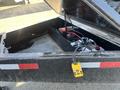 A 2024 Southland SL716-20K trailer with an open storage compartment showing internal wiring and a yellow control panel connected to the battery