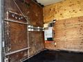 Interior of a 2013 Ford Econoline van with wood paneling and metal fixtures visible along the walls