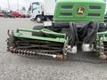 A green 2009 John Deere 2653B Precision Diesel Mower with a reel mower attachment visible in the foreground