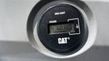 A close-up of the hour meter displaying 6073.0 on a Caterpillar excavator dashboard